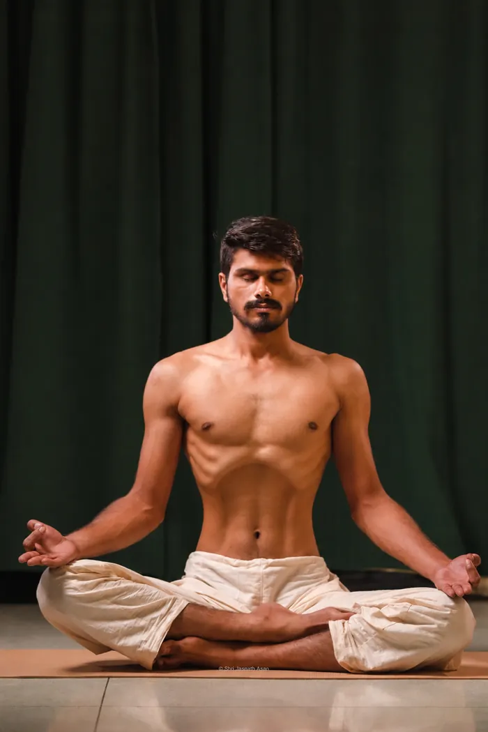 The belly snapped in. This is the stroke: one sharp push out through the nose, and the abdomen does it, not the chest.